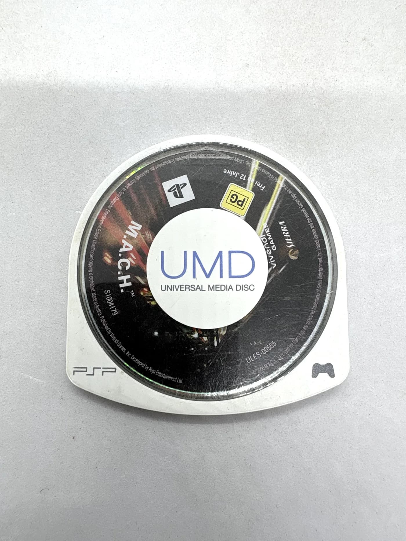 M.A.C.H. PSP (cartridge/disc only) -> For PSP it's typically "disc only" or "game only". "sama gra" in Polish retro e-commerce means "game only" / "disc only" (or cartridge only). Let's use "game only" or "disc only". "game only" is standard and accurate.M.A.C.H. PSP (game only)